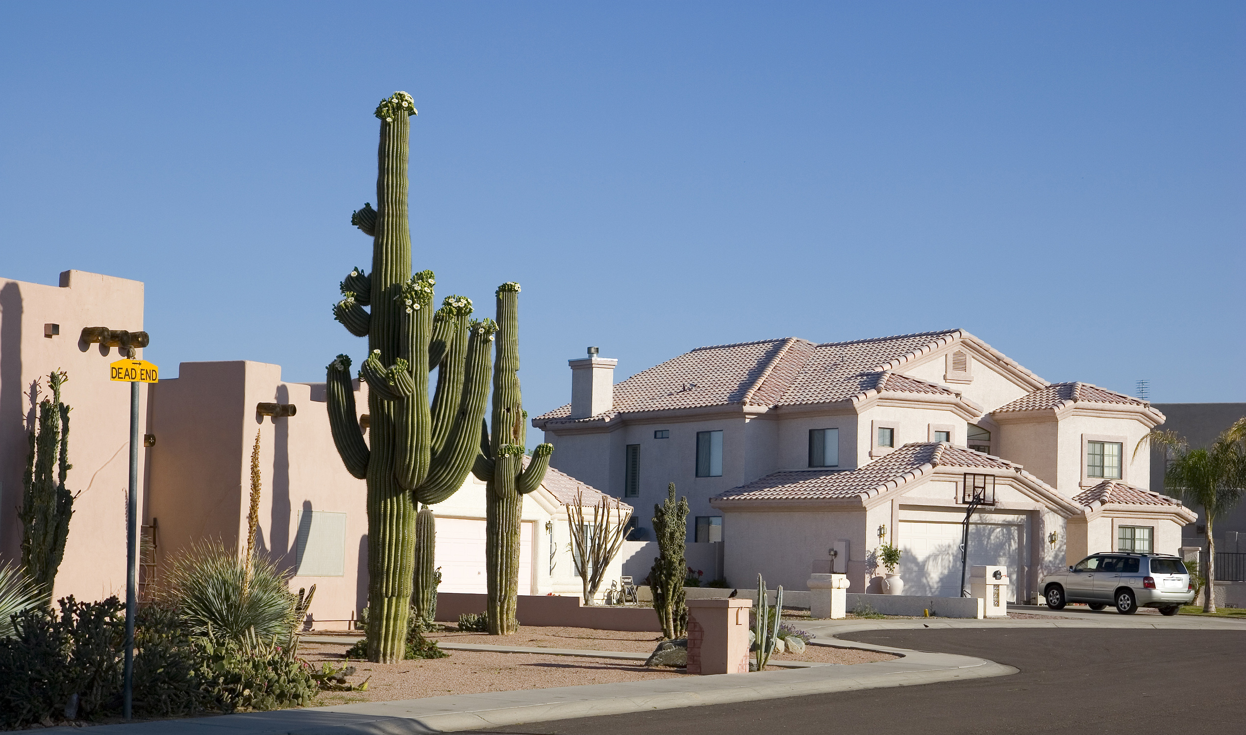 a close up of a street in front of a house