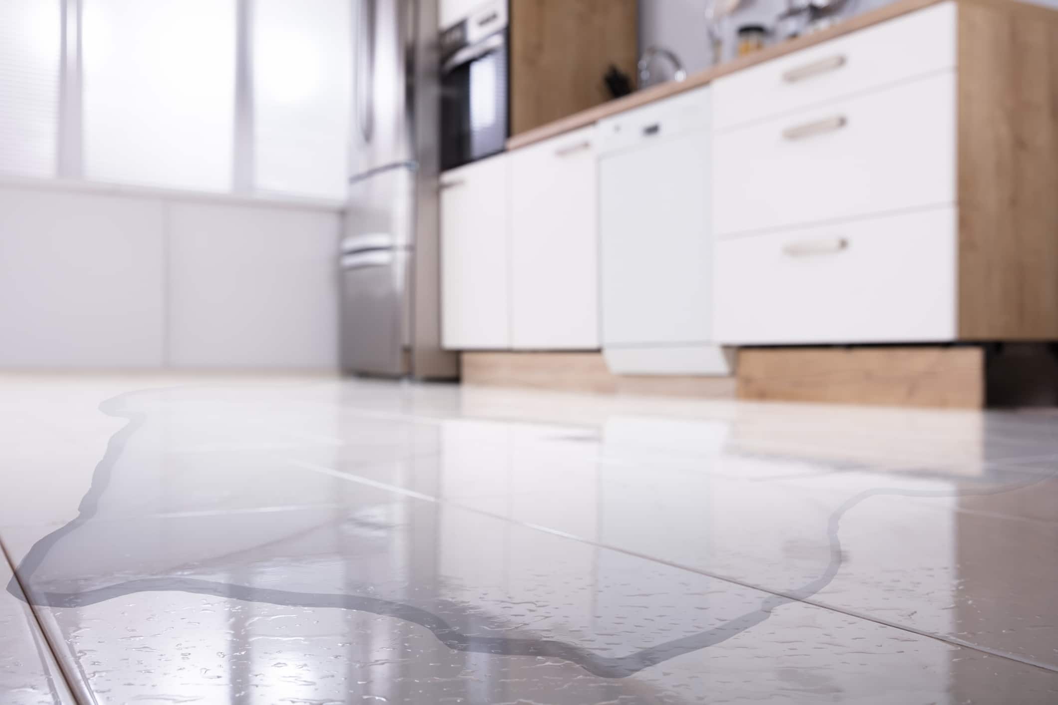 a kitchen with a tile floor