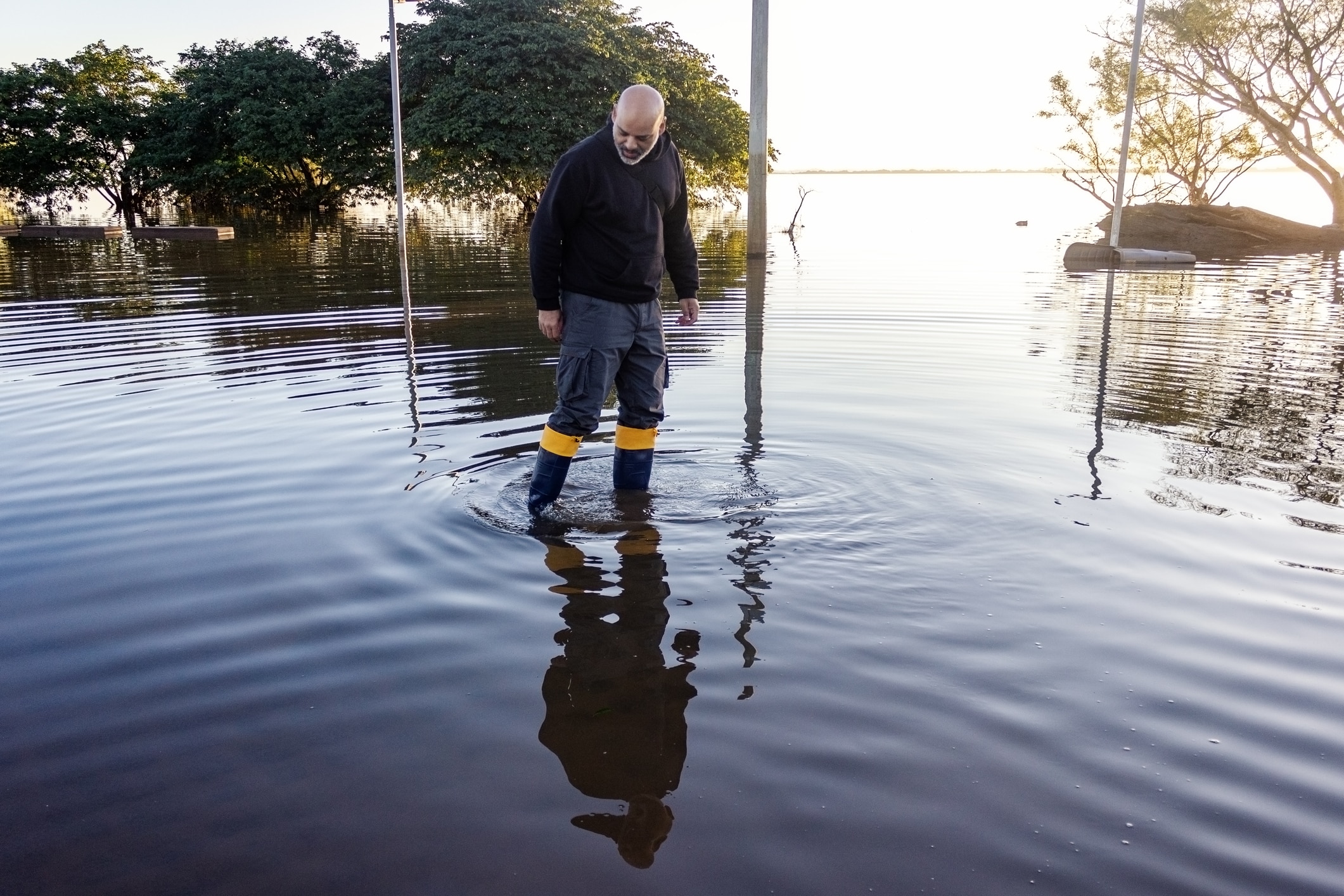 a man that is standing in the water