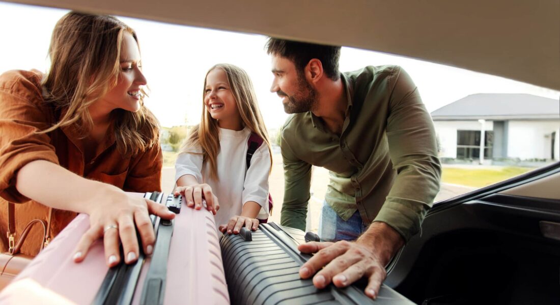 A Person Using A Laptop Computer Sitting On Top Of A Piano